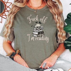 Fuck Off I'm Reading Unisex T-Shirt Skull and Books Graphic Sarcastic Halloween Tee Book Lovers Halloween Shirt for Introverts T-shirt Heather Olive