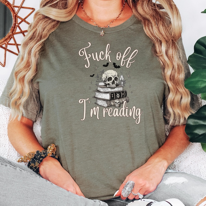 Fuck Off I'm Reading Unisex T-Shirt Skull and Books Graphic Sarcastic Halloween Tee Book Lovers Halloween Shirt for Introverts T-shirt Heather Olive