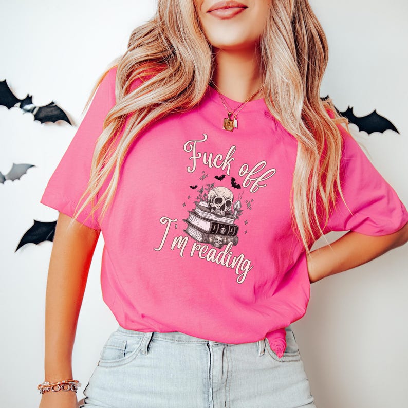 Fuck Off I'm Reading Unisex T-Shirt Skull and Books Graphic Sarcastic Halloween Tee Book Lovers Halloween Shirt for Introverts T-shirt Charity Pink