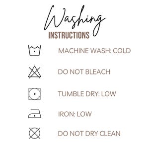 May include: White background with washing instructions in brown and black text. The text reads "Washing Instructions" in a script font. Symbols indicate machine wash cold, do not bleach, tumble dry low, iron low, and do not dry clean.
