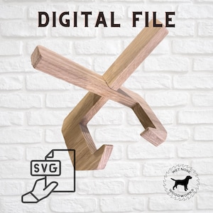 May include: A light brown wooden stand with a cross-shaped top and two curved supports for holding items. The text DIGITAL FILE appears at the top, with an SVG icon and a circular logo featuring a dog silhouette and the text WET NOSE WOODWORKS.