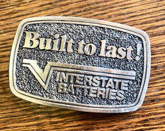 Vintage Limited Edition - Interstate Batteries "Built to Last!" Embossed Belt Buckle, Retiree Gift, Collectible.   Bin KJ7