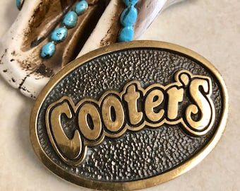 Vintage 1978 Solid Brass “Cooter's”Belt Buckle with a Textured Background, Oval Shaped, Made in USA, Collectible. Bin RW2