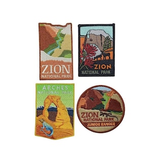 May include: Four embroidered patches featuring different national parks. The patches are rectangular and circular, with colorful images of landscapes and park names. The patches include Zion National Park, Arches National Park, and Zion National Park Junior Ranger.