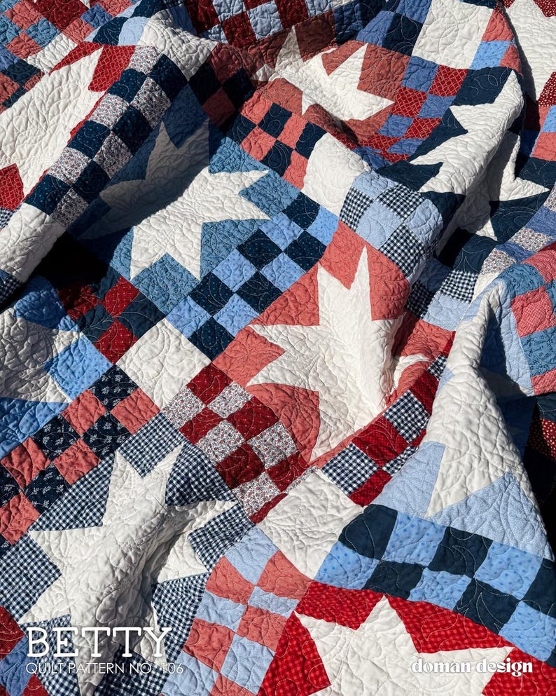May include: A patchwork quilt featuring a repeating star pattern in white, red, and various shades of blue. The design incorporates checkered and floral fabric squares with intricate quilted stitching throughout. Text reads BETTY QUILT PATTERN NO 106.