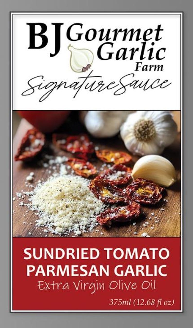 May include: A product label for BJ Gourmet Garlic Farm Signature Sauce. The image features sundried tomatoes, Parmesan garlic, and extra virgin olive oil. The label indicates a 375ml (12.68 fl oz) volume.