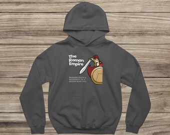 May include: Dark grey hoodie with a graphic of a Roman soldier with a sword and shield. The text "The Roman Empire" and a slogan are printed above the graphic. The hoodie has a hood and a front pocket.