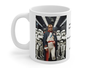 May include: A white ceramic mug with a colorful image of a man in a white and red uniform standing in front of a line of stormtroopers. The text on the mug reads "Napoleon Bonaparte, Emperor of the French, Revolutionary General, Dictator, and the first person to be called "The Little Corporal"."