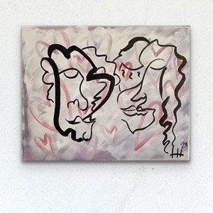 May include: Abstract painting of two faces with pink and purple background. The faces are drawn in black ink and are surrounded by hearts.
