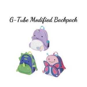 May include: Three G-Tube Modified Backpacks featuring animal designs. One is a purple narwhal, one is a green dinosaur with spikes, and one is a pink and blue butterfly. Each backpack has a top handle, shoulder straps, and a front zippered pocket.