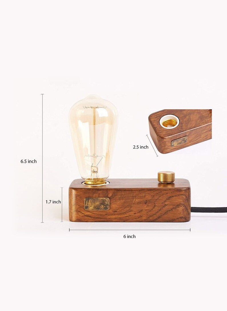 May include: A wooden table lamp with a brown wooden base and a gold metal switch. The lamp has a clear glass bulb and is 16.5 cm tall, 15.2 cm wide, and 4.3 cm deep.