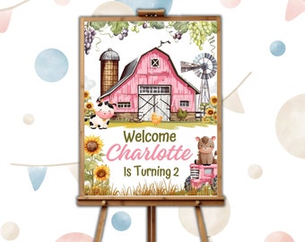 May include: Welcome to Charlotte's 2nd birthday party! A pink barn with a white door and a windmill stands in a field of sunflowers. A cow, a chick, and a tractor with a brown horse are in the scene.