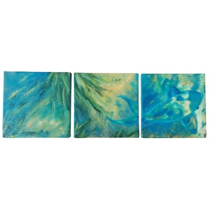 May include: A set of three abstract paintings on canvas. The paintings feature a blue and green color scheme with hints of gold. The paintings are abstract and feature a variety of shapes and lines.