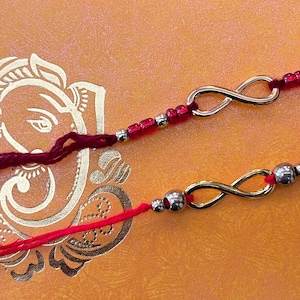 Infinite Bonds: Designer Rakhis with Timeless Infinity Centerpiece