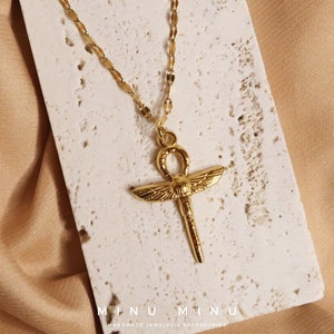 NUBIA - Golden stainless steel necklace with Egyptian cross pendant | Dragonfly design in Egyptian Ankh style | Symbolic jewelry unisex