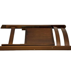 May include: A brown wooden folding chair with a slatted back and seat. The chair is folded and the seat is facing up.