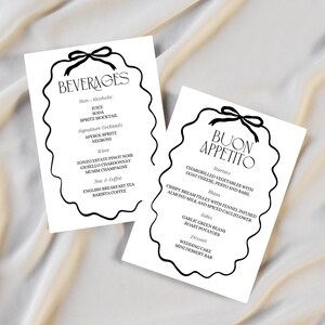 May include: Two black and white printable wedding menu cards with a decorative border. The top card lists beverages, including wine, champagne, and coffee. The bottom card lists the menu, including starters, main course, sides, and dessert. The text on the bottom card reads "Buon Appetito".