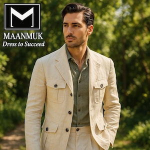 May include: A beige safari jacket with four front pockets and a matching pair of pants. The jacket is buttoned and worn over a green button-down shirt. The image includes the text "MAANMUK Dress to Succeed" in the upper left corner.