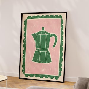 May include: A framed illustration of a green coffee pot with a pink background and a green border. The border has a scalloped edge.