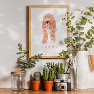 May include: A framed illustration of a brown dog with the name "BEANS" printed below. The illustration is surrounded by potted plants and a white pitcher.