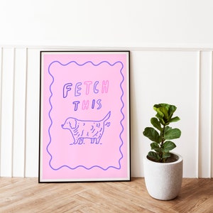 May include: A pink poster with a blue outline and a wavy border. The poster features a cartoon dog with the text "FETCH THIS" in pink and blue letters.