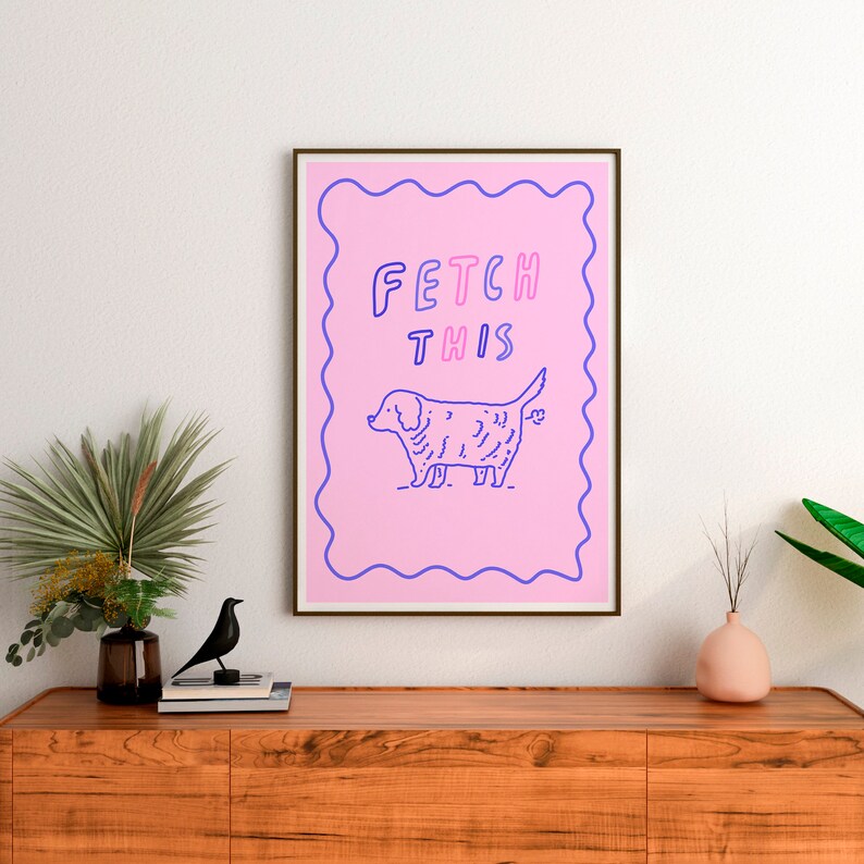May include: A pink and blue illustrated print with a dog and the text "FETCH THIS".