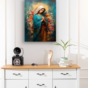 May include: A painting of the Virgin Mary in a blue robe with a crown of flowers around her head. The background is a blue and green abstract design.