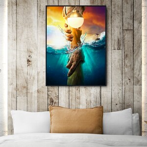 May include: A painting of a hand reaching out from the water to grasp a hand holding a light bulb. The background is a sunset with clouds and a helicopter in the distance.