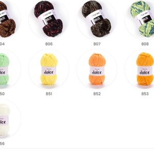 May include: A selection of yarn skeins in shades of brown, green, yellow, and orange. Each skein is labelled with the word "dolce" and a number. The yarn is arranged in rows and columns, showcasing a variety of colours.