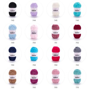May include: A selection of Dolce yarn skeins in a range of colours, including white, black, red, blue, pink, and green. Each skein is labelled with the word "dolce". The image showcases a variety of yarn colours suitable for knitting and crochet projects.