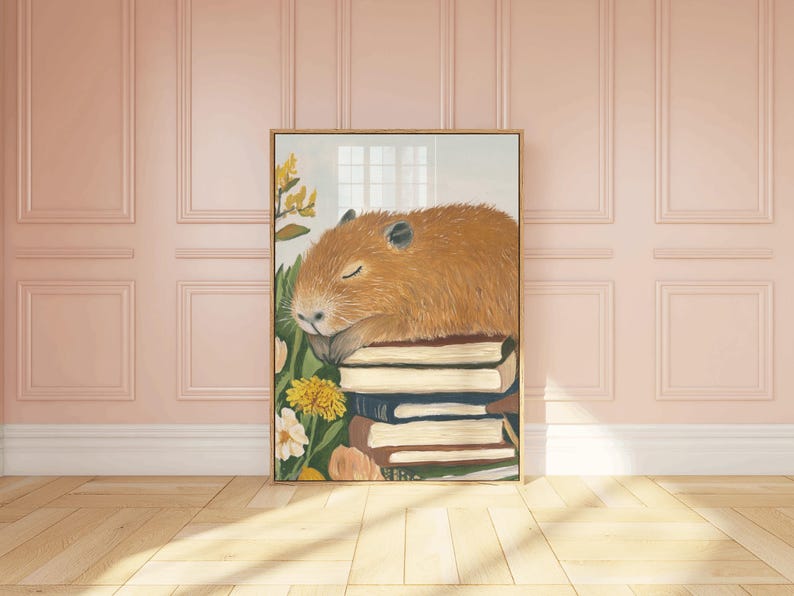 May include: A painting of a brown capybara sleeping on a stack of books. The capybara is surrounded by yellow flowers and green leaves.