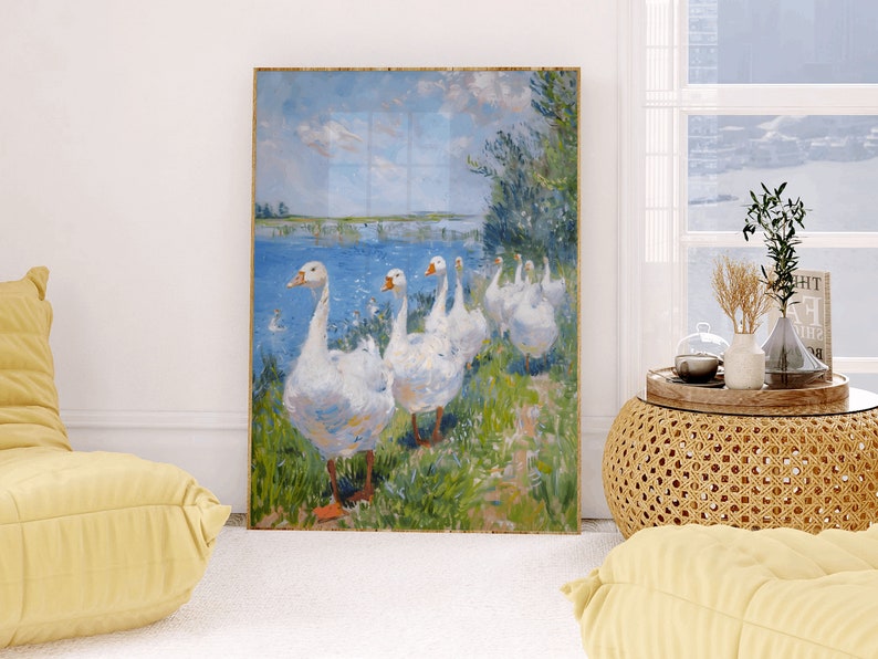 May include: A painting of a group of white geese walking along a grassy bank by a blue lake. The geese are in a line, with their heads held high. The painting is done in a loose, impressionistic style.