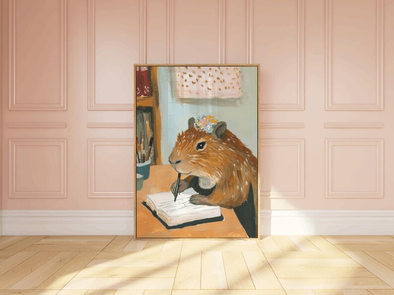 May include: A painting of a capybara wearing a flower crown and writing in a journal with a pen. The capybara is sitting at a table with a book and other items on it. The background is a light blue colour.