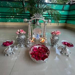 German Silver Combo Of 1 Swing, Set Of 2 Peacock Deepam, Set Of 2 Flower Vase, 2 Elephant Platter, 1 Flower Cut Urli, Free Express Delivery