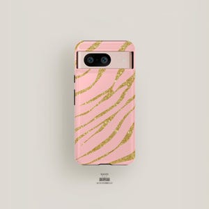 May include: A pink phone case with a gold glitter zebra print design.