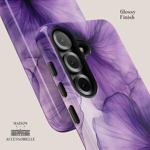 Elegant phone case with abstract violet ink flowers and fine black linework in a soft watercolor bloom effect. Available in iPhone, Samsung Galaxy, and Google Pixel models. Ink flower design, purple watercolor art, floral phone case, artistic accessory, abstract botanical style, delicate gradient pattern.