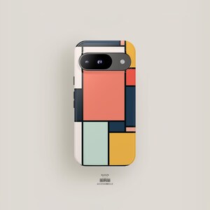 May include: A white phone case with a geometric pattern in shades of red, blue, yellow, and green. The case has a cutout for the camera lens.