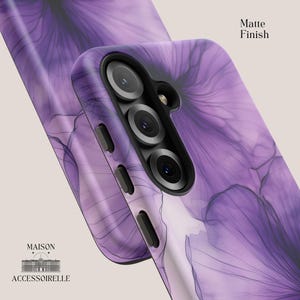Elegant phone case with abstract violet ink flowers and fine black linework in a soft watercolor bloom effect. Available in iPhone, Samsung Galaxy, and Google Pixel models. Ink flower design, purple watercolor art, floral phone case, artistic accessory, abstract botanical style, delicate gradient pattern.