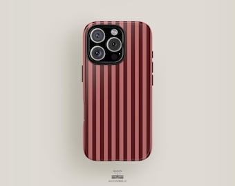 May include: A phone case with a vertical striped pattern in shades of red and pink. The case has a glossy finish and a camera module with three lenses and a flash. The brand name "MAISON ACCESSOBELLE" is printed at the bottom.