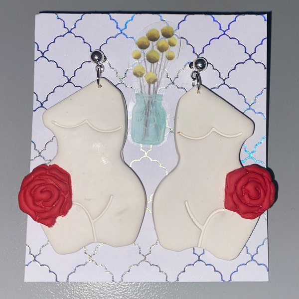 Full figure woman earrings with rose