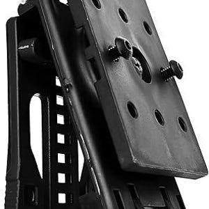 May include: Black Tech-Lock mount with adjustable cant. The mount features a rectangular plate with multiple holes and two screws. The text "Rotating Tech-Lock For adjustable Cant" is visible.
