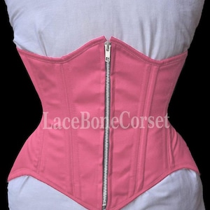 May include: A pink cotton corset with a zipper closure and the text "LaceBoneCorset" printed on the front.