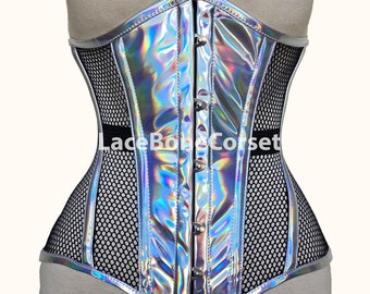 May include: A silver holographic corset with black mesh panels and silver metal busk closures. The corset has a lace-up back and is made of a shiny, iridescent fabric.