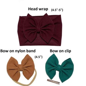May include: A collection of baby headbands and bows in various styles and colors. Includes a burgundy head wrap (4.5"-5"), a tan bow on a nylon band (4.5"), and a teal bow on a clip. Perfect for baby girls.