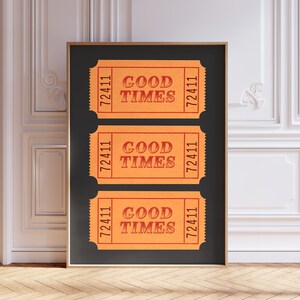 May include: Three orange ticket-shaped prints with the text "Good Times" and the number "72411" on a black background.