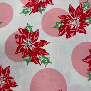 Swell Christmas by Urban Chiks  Red Poinsettia with pink dots on white background. By the 1/2 yard.