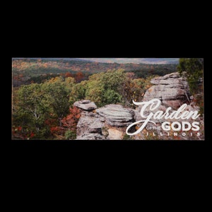May include: A scenic view of a rocky landscape with trees in the background. The text "Garden of the Gods Illinois" is superimposed on the image.