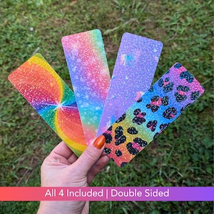 May include: Four double-sided iridescent bookmarks with glitter. The designs include a rainbow swirl, a rainbow with white polka dots, a purple unicorn, and a leopard print.