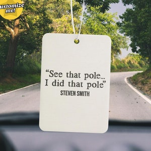 May include: White car air freshener with the text "See that pole... I did that pole" and "STEVEN SMITH" printed on it.