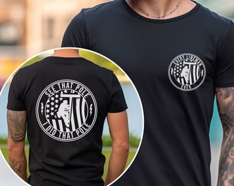 May include: Black t-shirt with a white graphic on the front that says "Every Lineman Ever" and a white graphic on the back that says "See That Pole I Did That Pole".